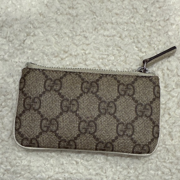 Gucci Handbags - Gucci Beige Monogram Zip Pouch